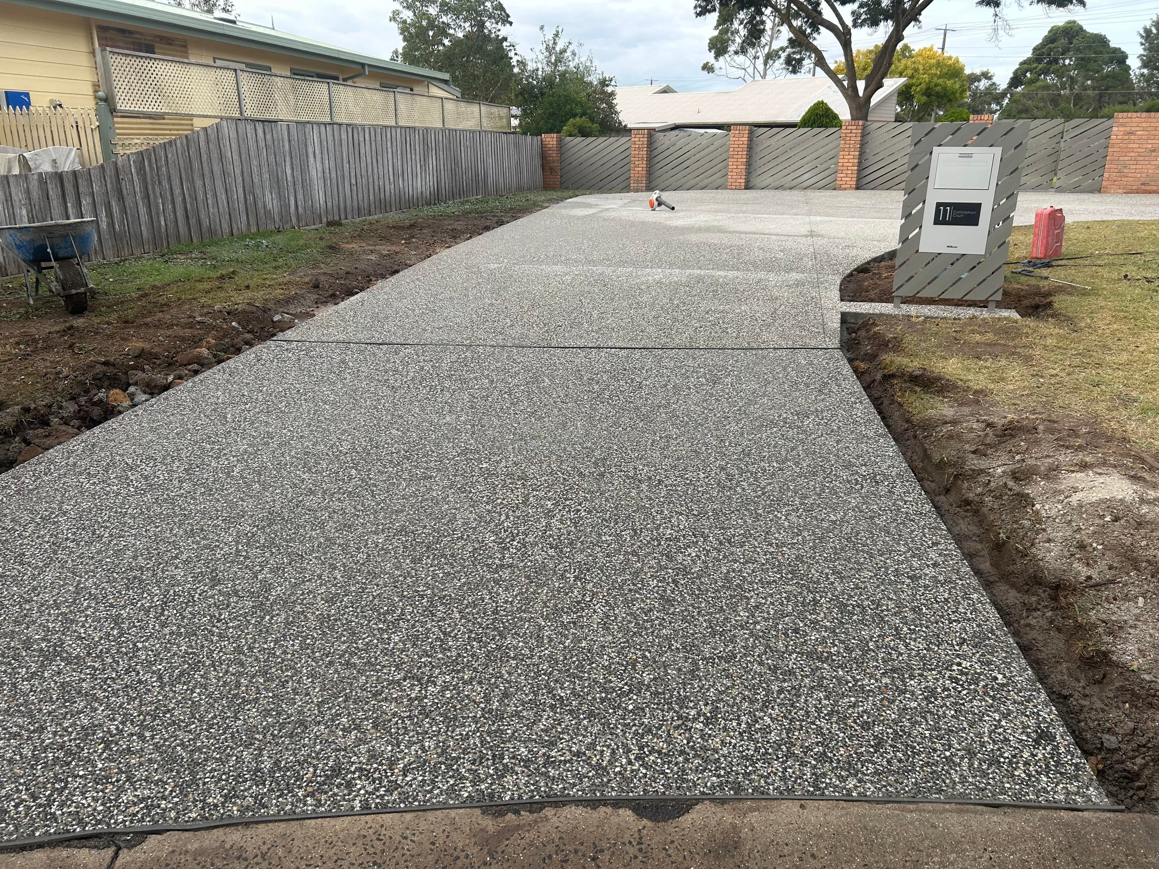 Exposed-aggregate concrete driveway with stone-textured finish, Queenscliff