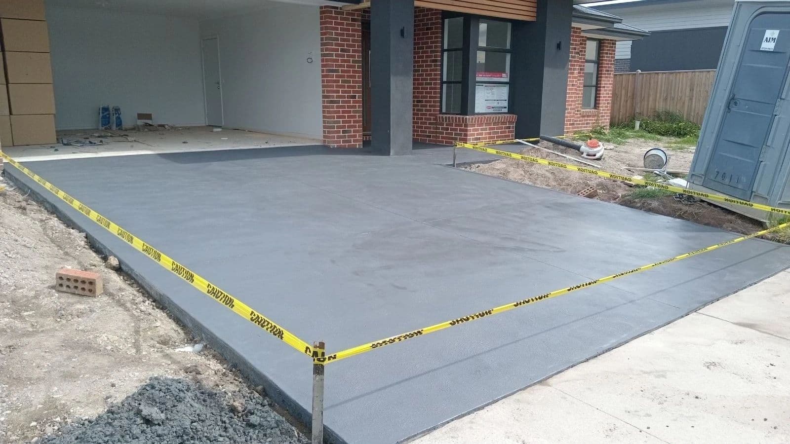 New coloured concrete driveway · Gippsland — TMT Concreting & Maintenance