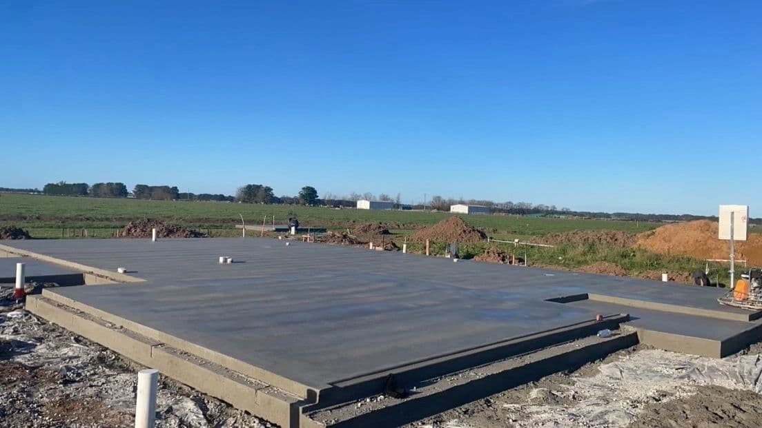 House slab with paddocks in the background · Gippsland — TMT Concreting & Maintenance