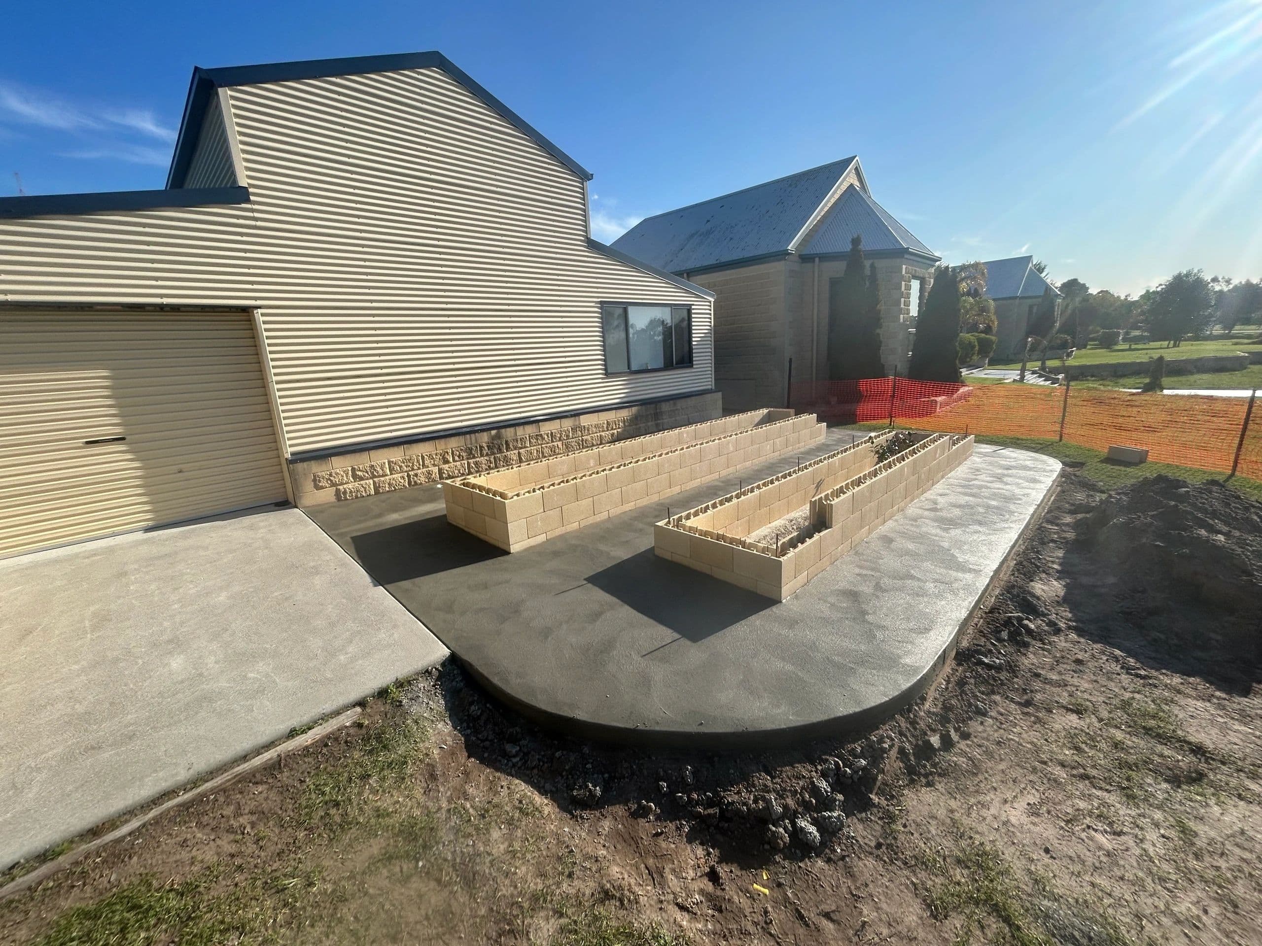 Concrete garden bed path · Gippsland — TMT Concreting & Maintenance