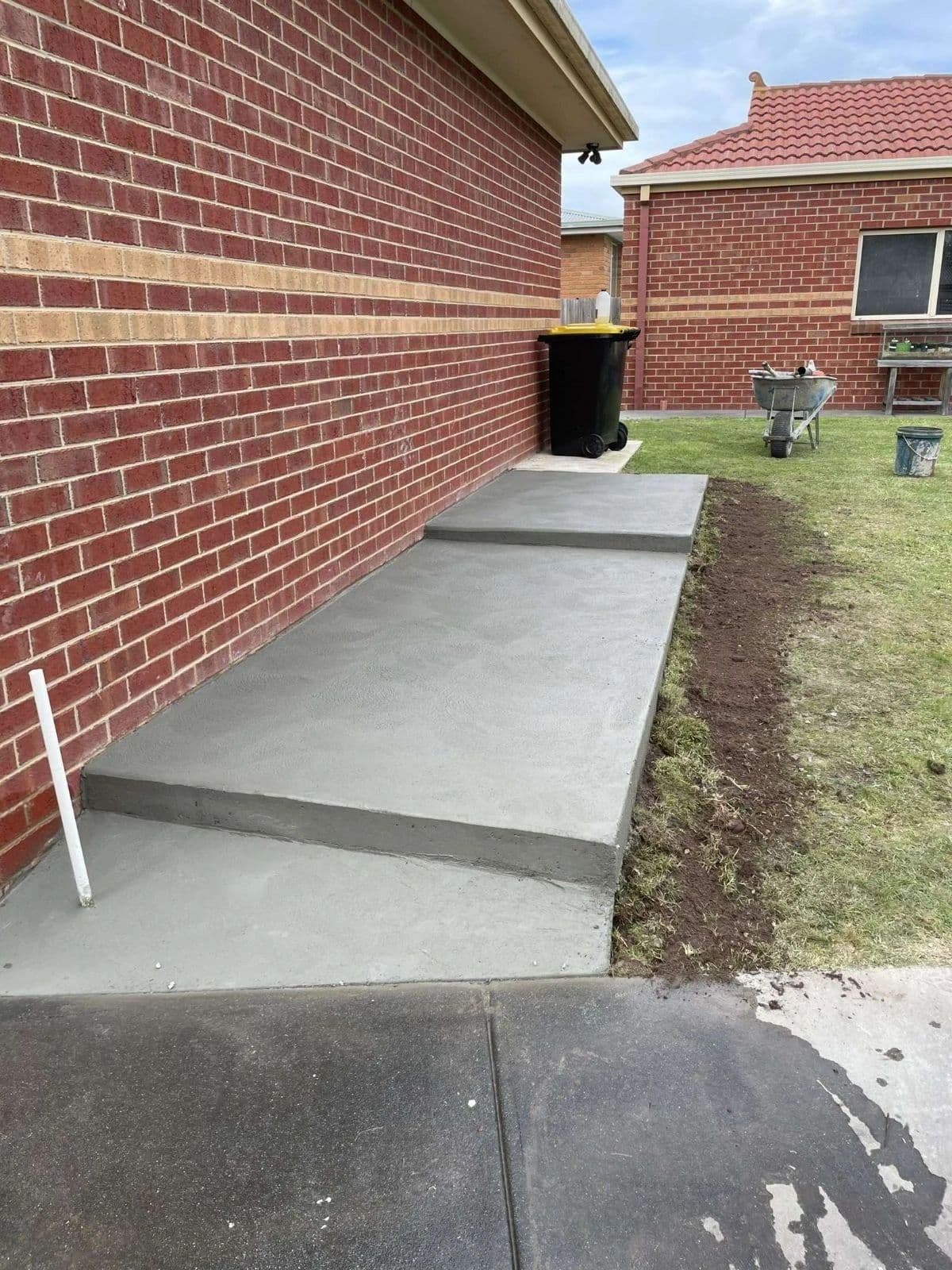 Concrete path and tank stand · Gippsland — TMT Concreting & Maintenance