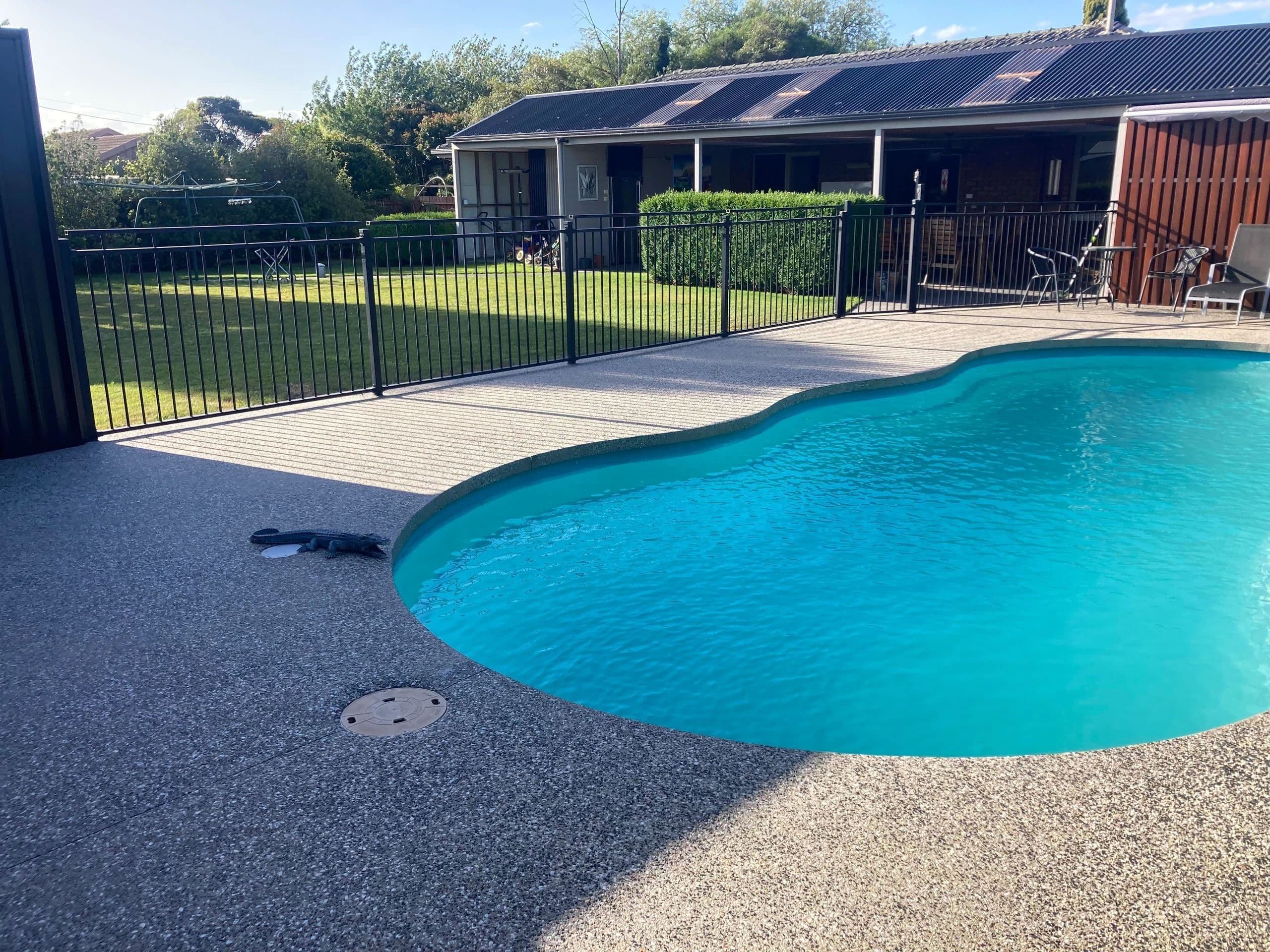 Exposed aggregate pool surround · Maffra — TMT Concreting & Maintenance